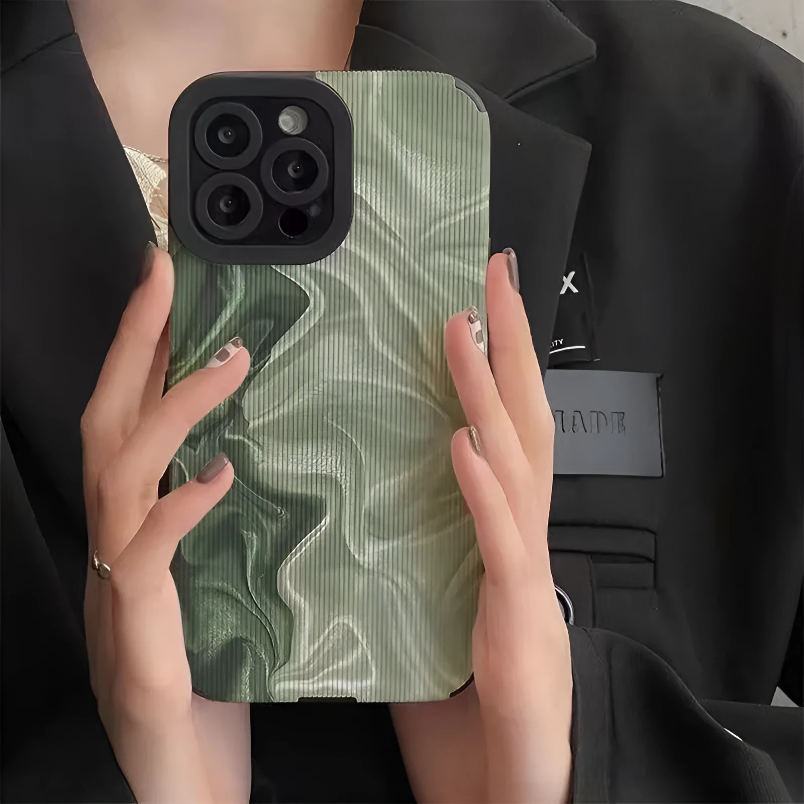 Silicone iPhone case with Chinese-style geometric metal-stamped design on imitation leather