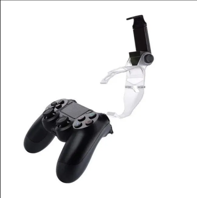Black PS4 controller clip holding a mobile phone, with a micro USB OTG cable connected.