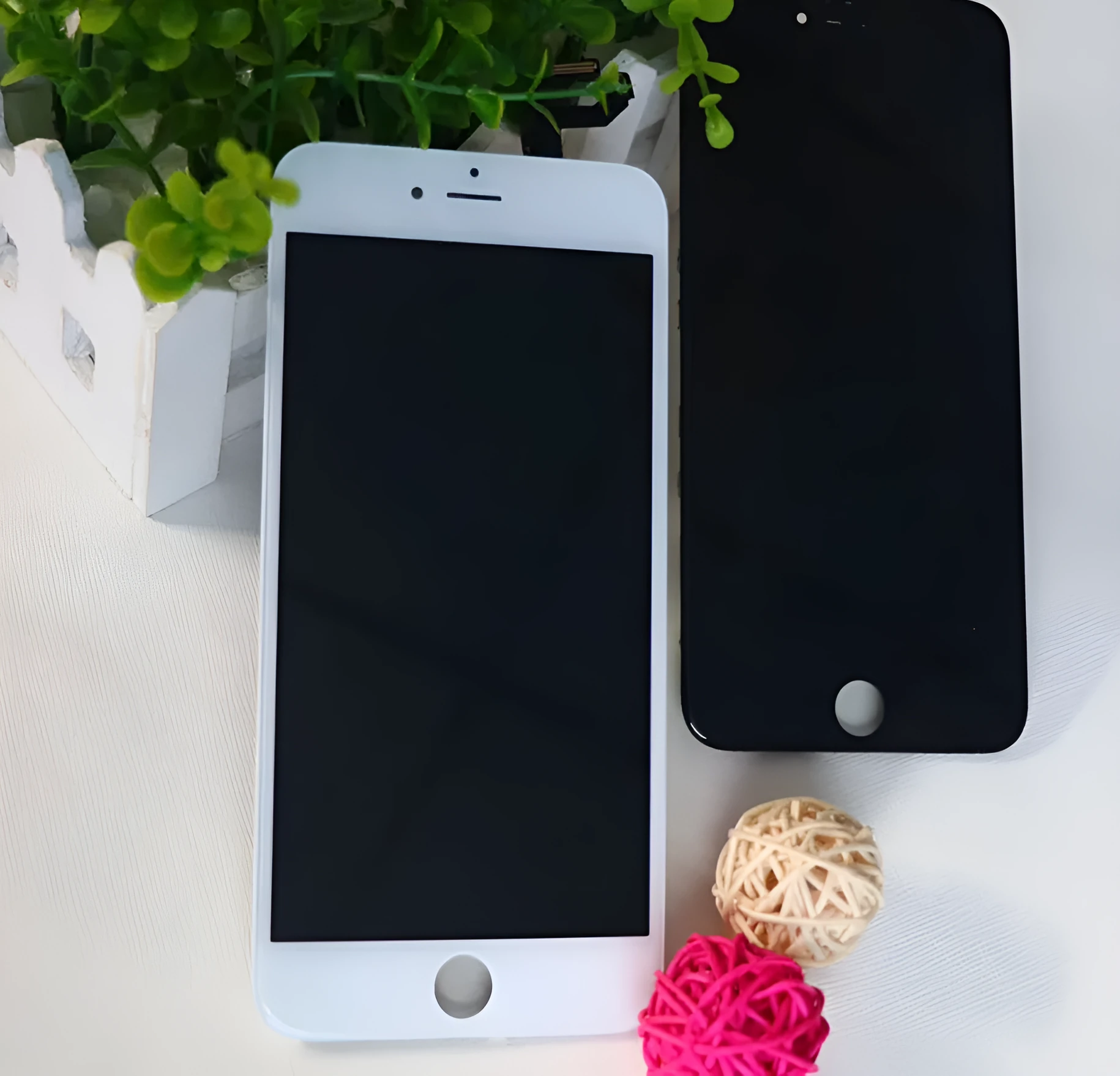 iPhone LCD replacement screen with capacitive touch layer and disassembly tool.