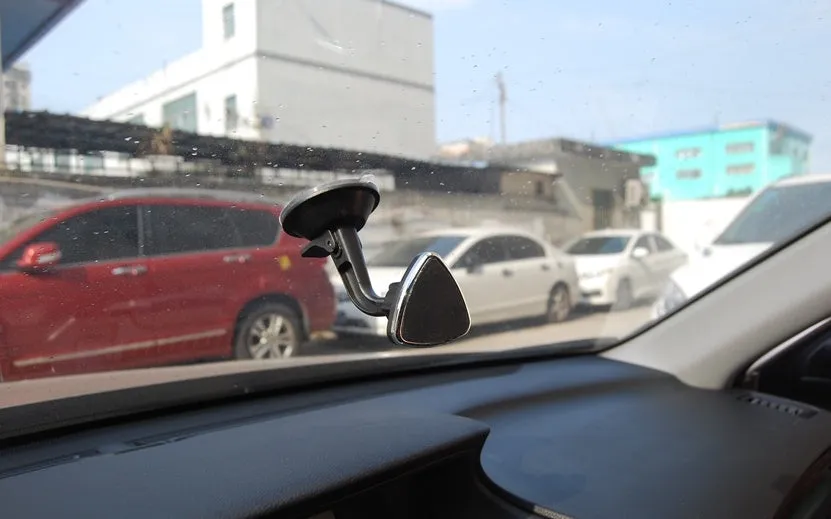 Black magnetic car phone holder with 360 rotation for dashboard mounting with iPhone and Samsung compatibility