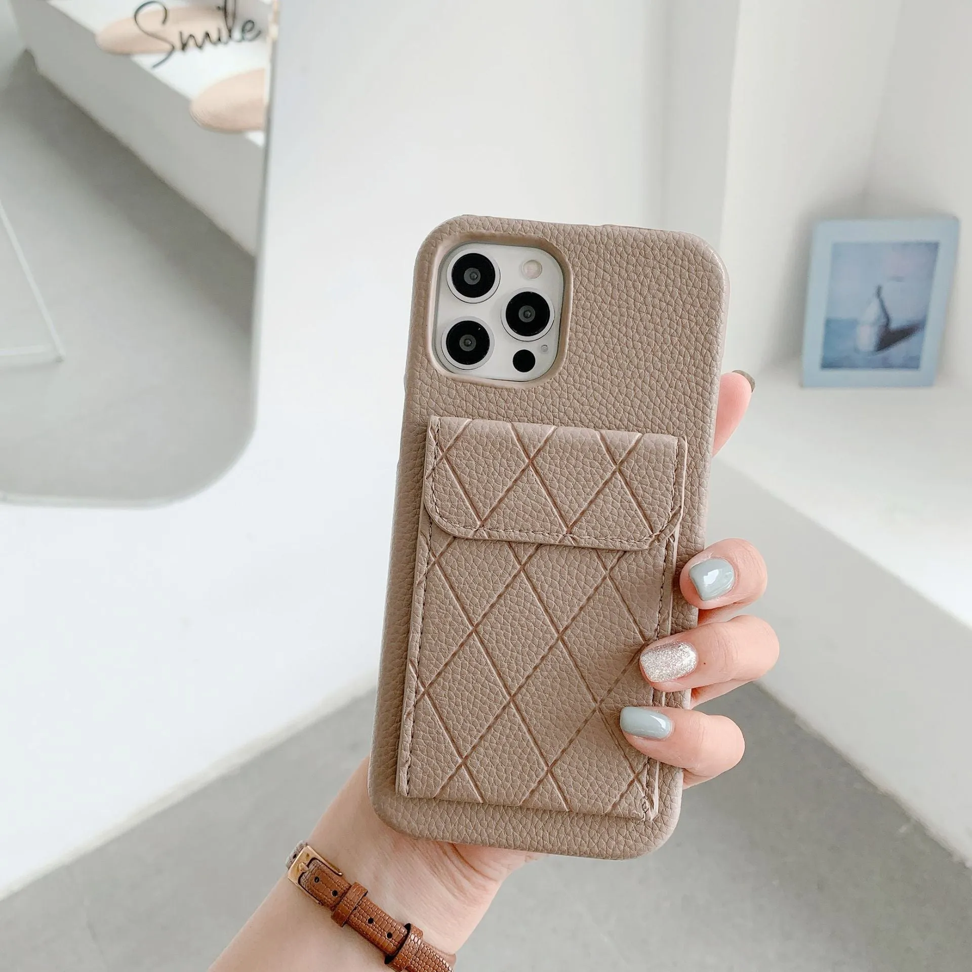 Tide Brand black imitation leather phone case with card slot for iPhone 12 Pro Max.