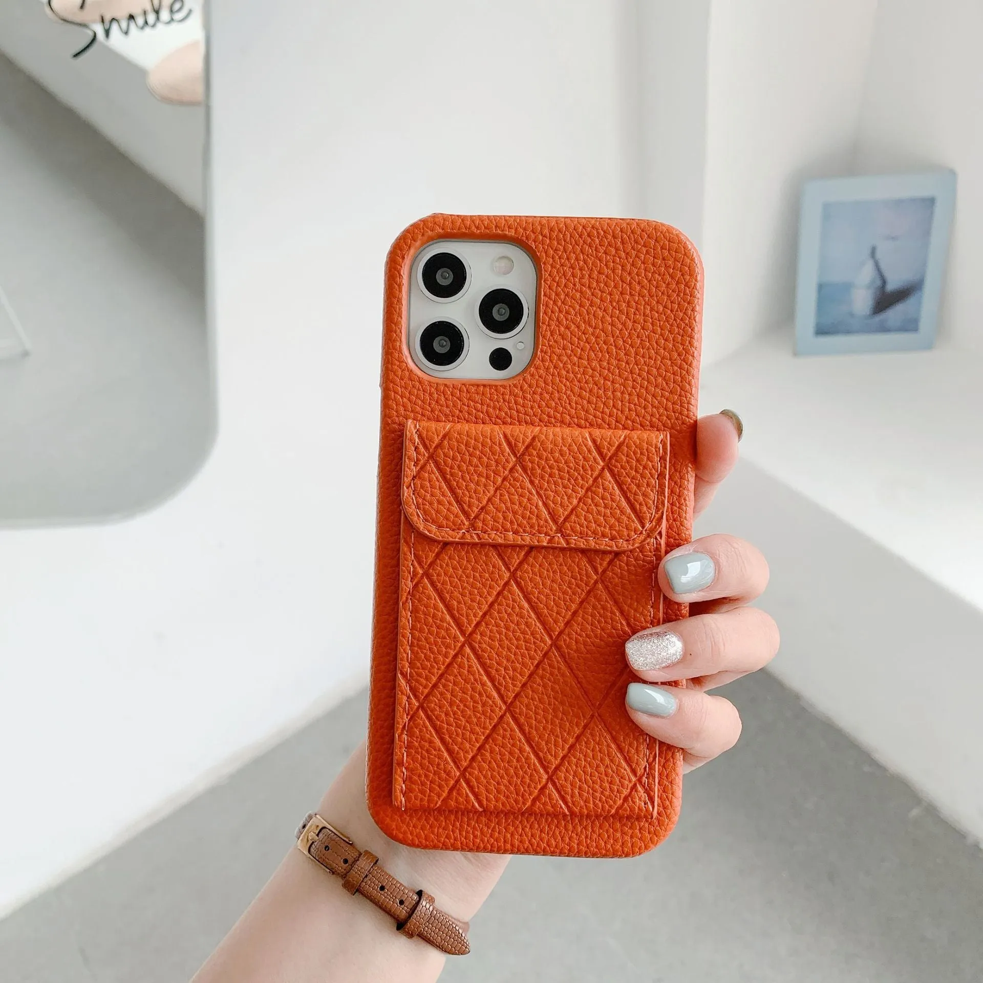 Tide Brand black imitation leather phone case with card slot for iPhone 12 Pro Max.