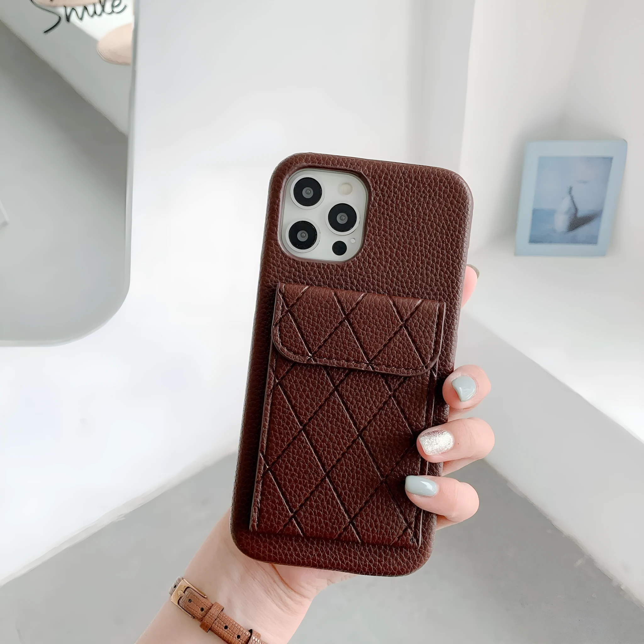Tide Brand black imitation leather phone case with card slot for iPhone 12 Pro Max.