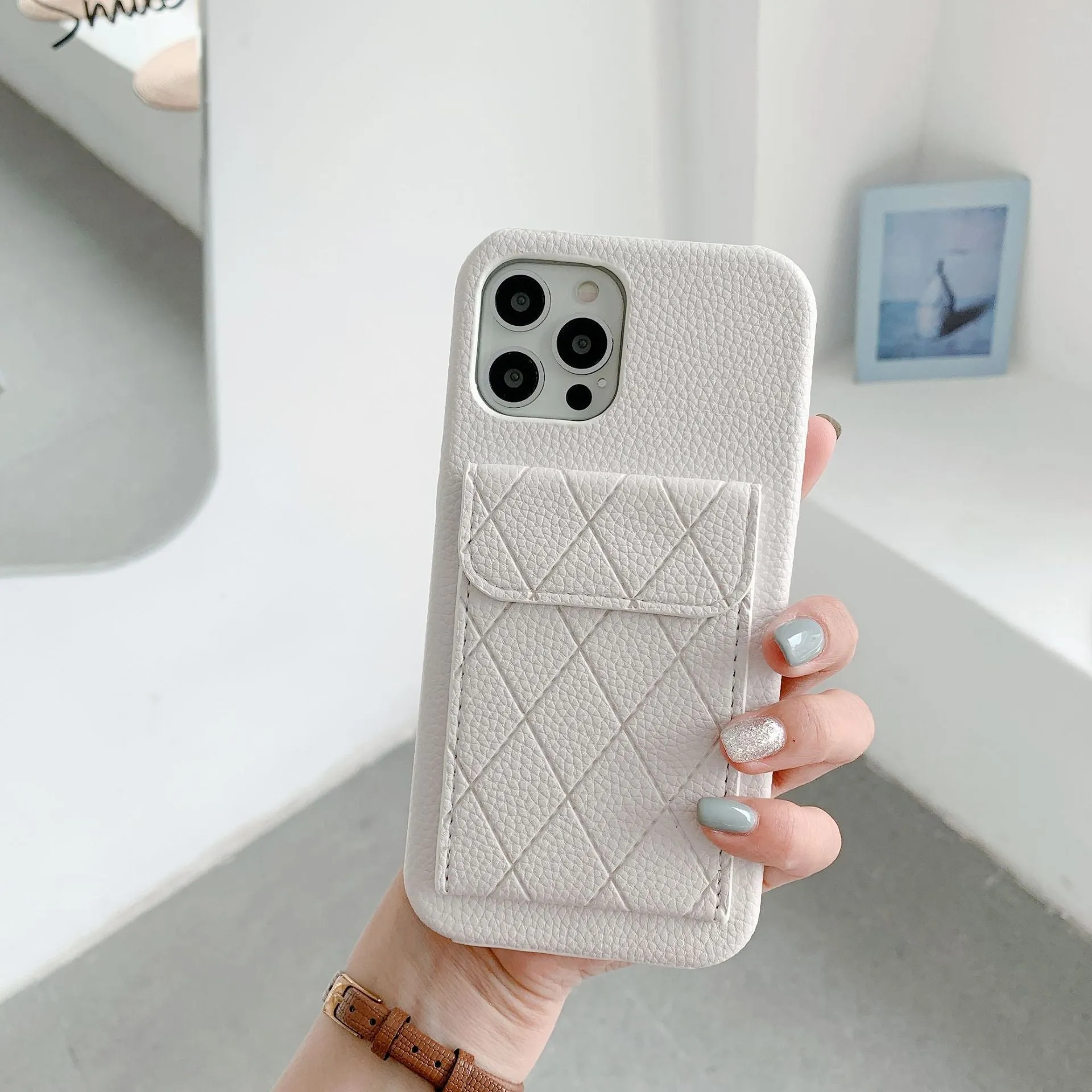Tide Brand black imitation leather phone case with card slot for iPhone 12 Pro Max.
