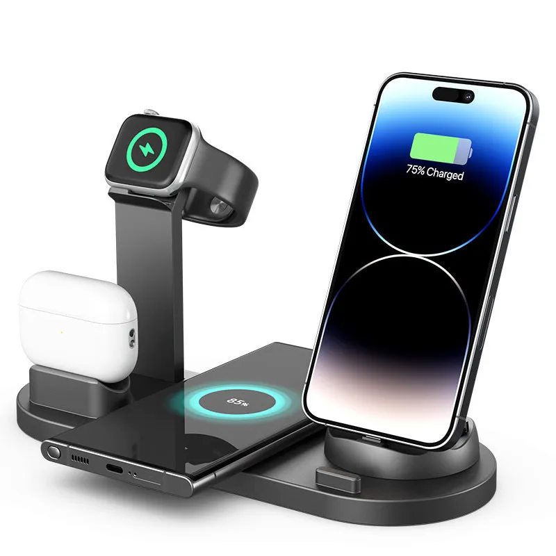 Black wireless charging stand holding a mobile phone, a smartwatch, and a headset on a desk.