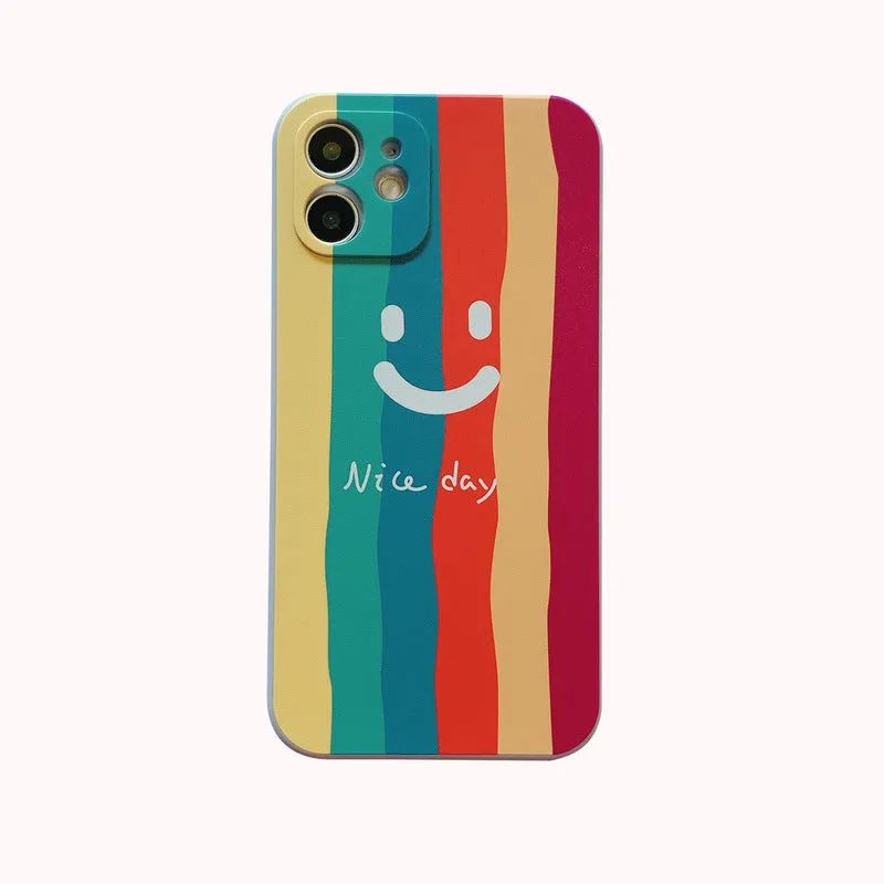 Simple silicone TPU iPhone case with a painted smiley face design on a solid colour background.