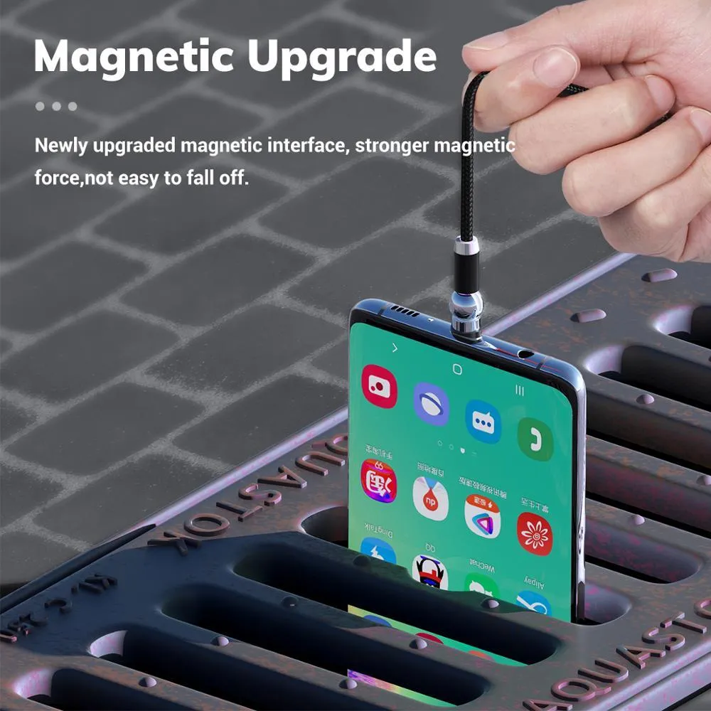 Black magnetic charging cable with spherical rotating head shown connected to mobile phone