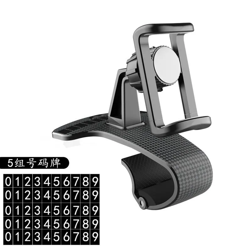 Black universal car phone mount with 360-degree rotating head on a car dashboard.