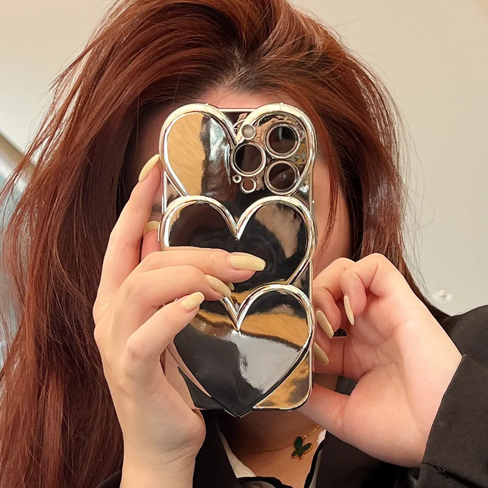 Soft TPU iPhone case with a silver three-dimensional love electroplating design on the back.