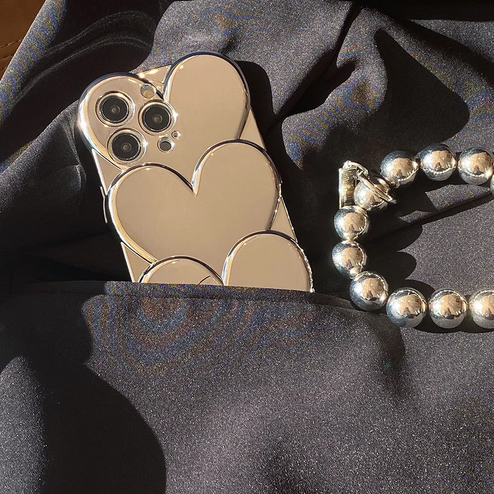 Soft TPU iPhone case with a silver three-dimensional love electroplating design on the back.