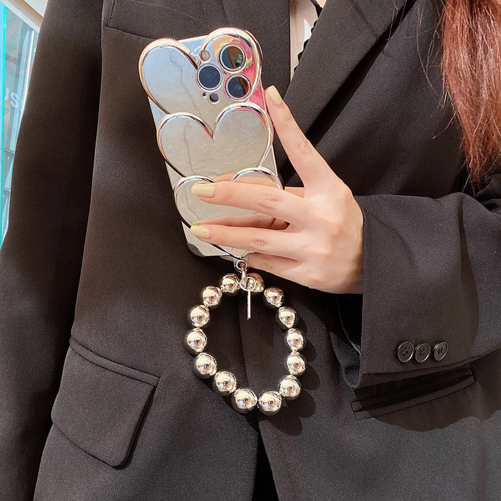 Soft TPU iPhone case with a silver three-dimensional love electroplating design on the back.