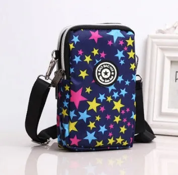 Vertical Oxford fabric ladies mobile phone bag with a zipper, shown in a printed design.