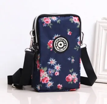 Vertical Oxford fabric ladies mobile phone bag with a zipper, shown in a printed design.