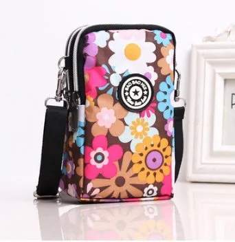 Vertical Oxford fabric ladies mobile phone bag with a zipper, shown in a printed design.