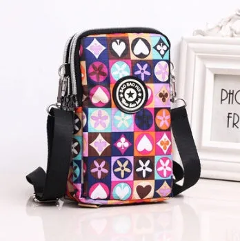 Vertical Oxford fabric ladies mobile phone bag with a zipper, shown in a printed design.