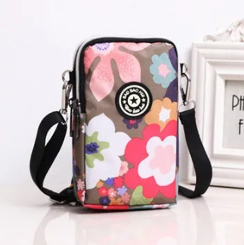 Vertical Oxford fabric ladies mobile phone bag with a zipper, shown in a printed design.