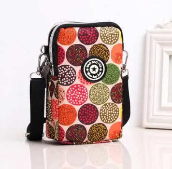 Vertical Oxford fabric ladies mobile phone bag with a zipper, shown in a printed design.