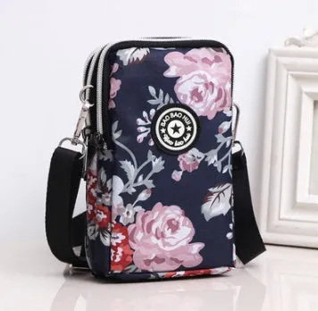 Vertical Oxford fabric ladies mobile phone bag with a zipper, shown in a printed design.