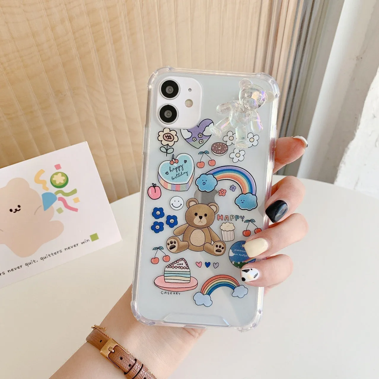 Bear chain charm on a TPU protective case for iPhone, featuring a Japanese Korean cartoon style design.