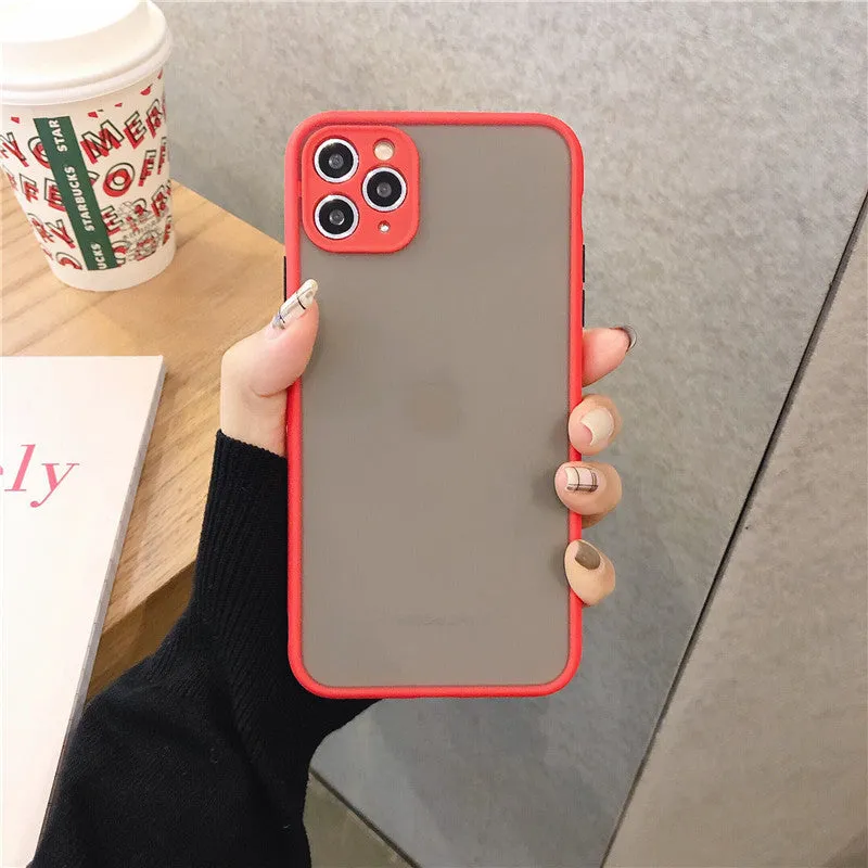 Transparent solid colour silicone shockproof protective case for iPhone on a dark background.