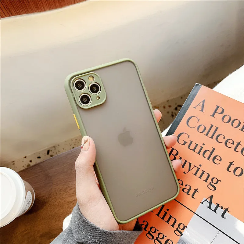Transparent solid colour silicone shockproof protective case for iPhone on a dark background.