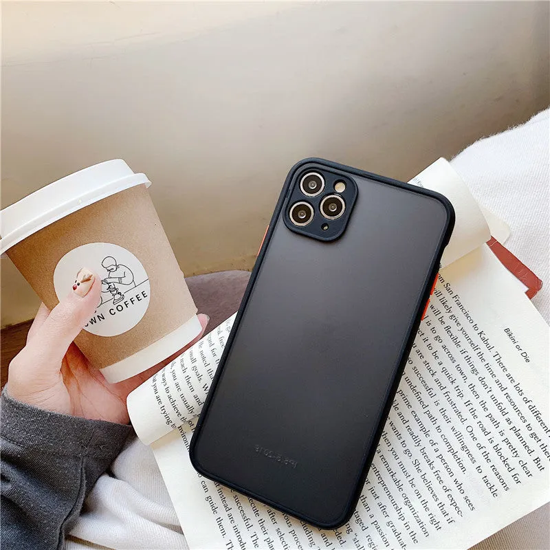 Transparent solid colour silicone shockproof protective case for iPhone on a dark background.