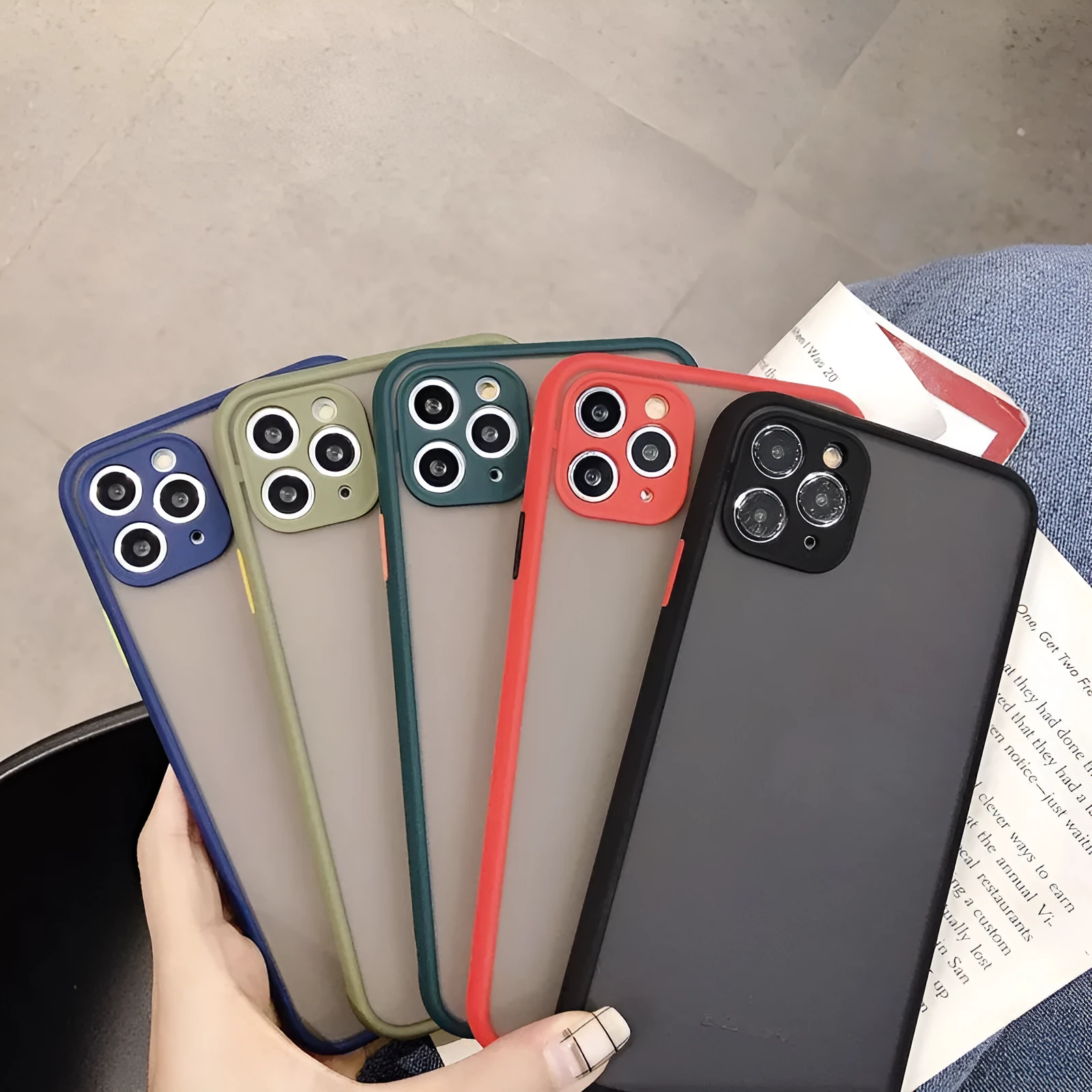 Transparent solid colour silicone shockproof protective case for iPhone on a dark background.