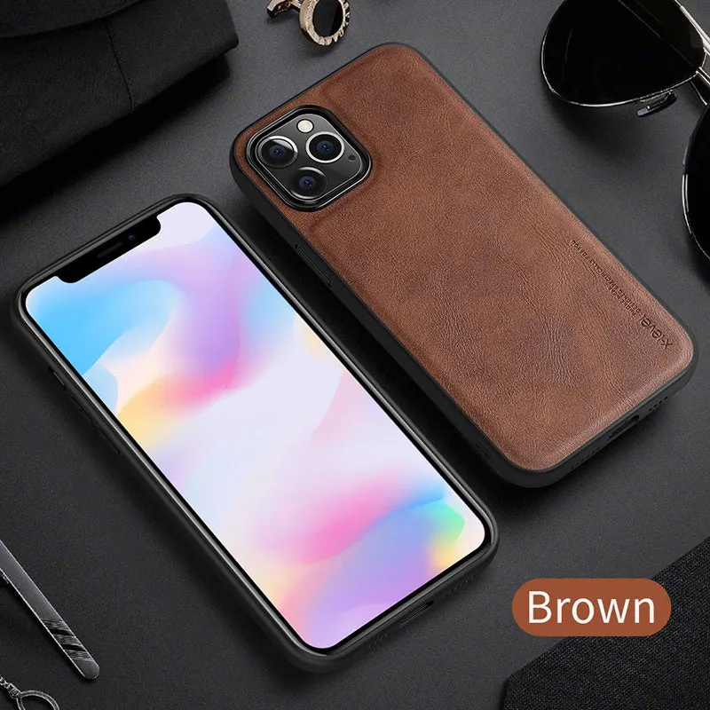 Black business leather phone case for iPhone 12 with PU leather and TPU frame on a wooden desk.