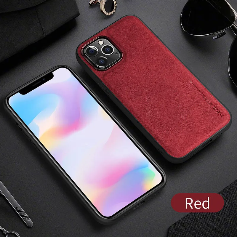 Black business leather phone case for iPhone 12 with PU leather and TPU frame on a wooden desk.