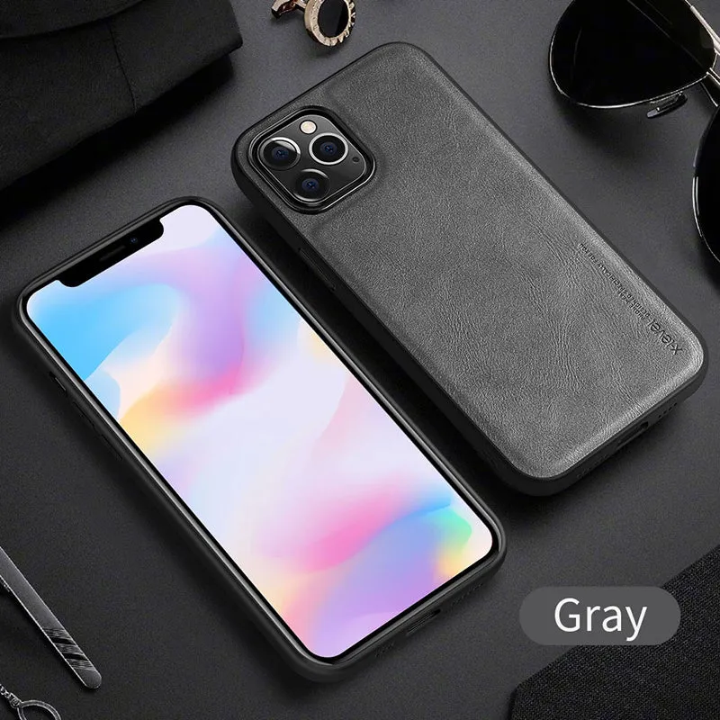 Black business leather phone case for iPhone 12 with PU leather and TPU frame on a wooden desk.