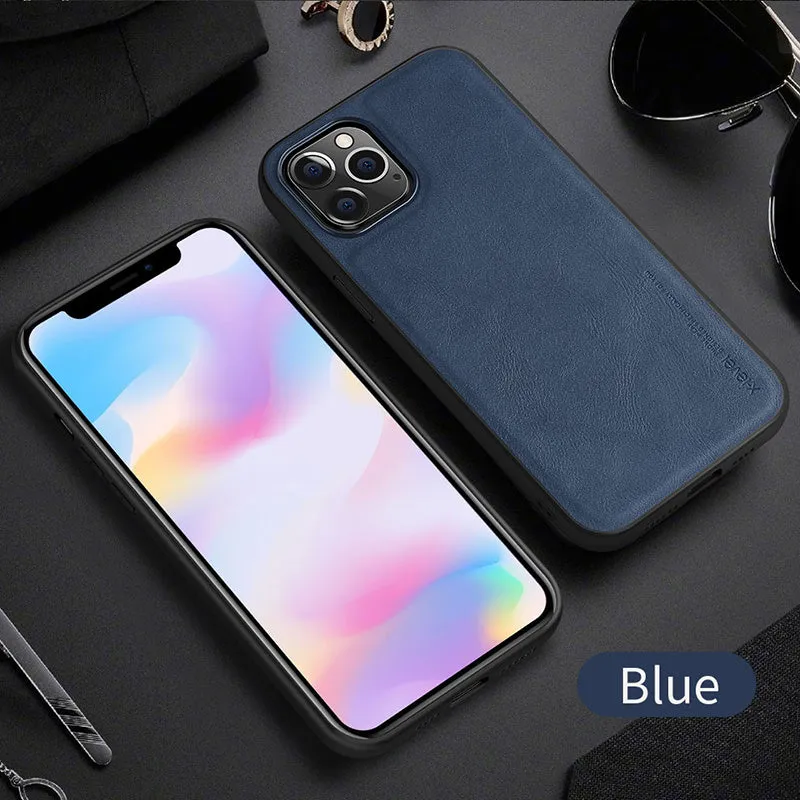 Black business leather phone case for iPhone 12 with PU leather and TPU frame on a wooden desk.