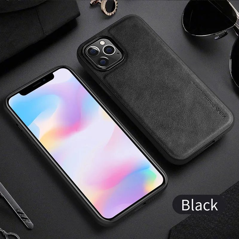 Black business leather phone case for iPhone 12 with PU leather and TPU frame on a wooden desk.