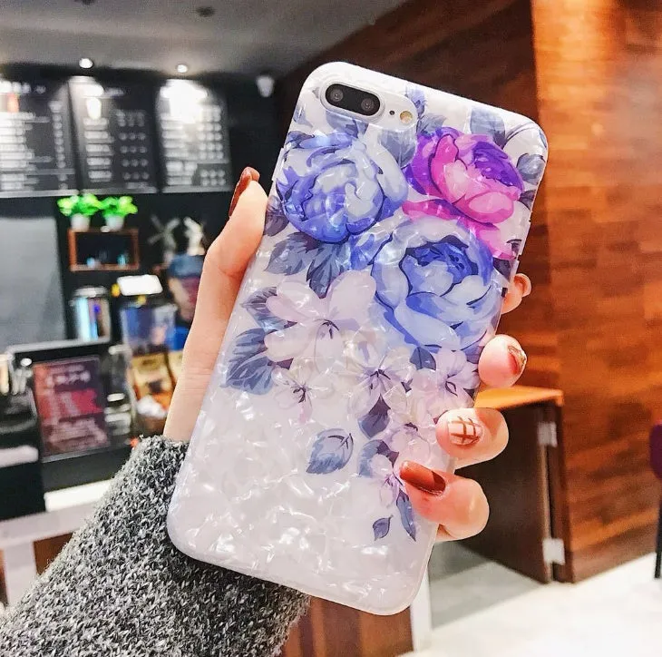 Dream Shell soft TPU iPhone case with rose flower pattern on back, shown in brown colour.