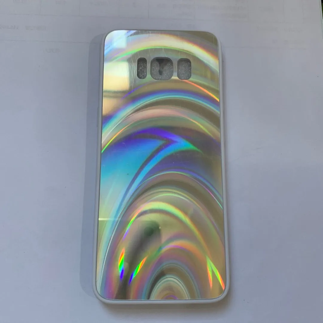 A 3D rainbow glitter gradient back cover case for a smartphone, showing its full-coverage design and sparkling finish.