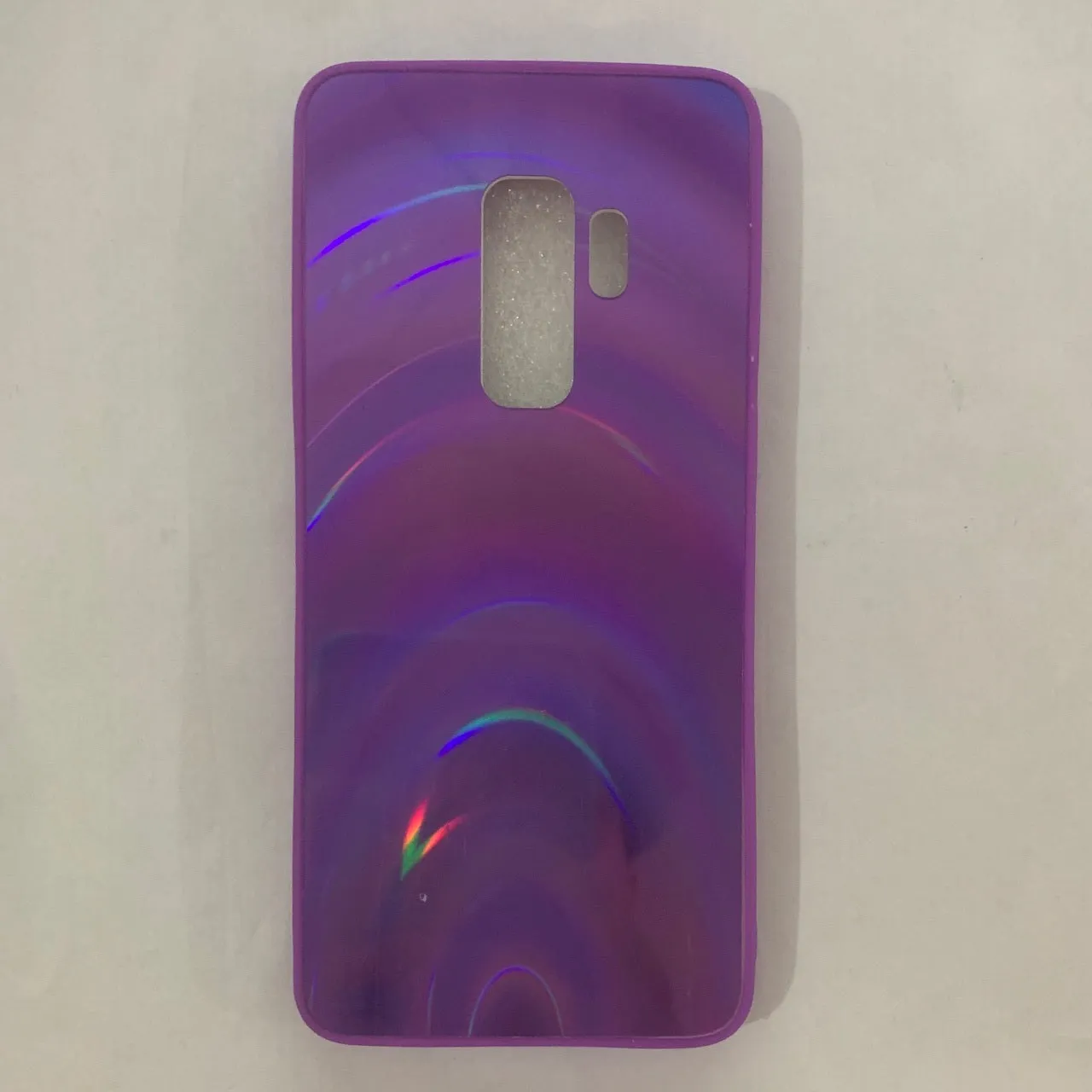 A 3D rainbow glitter gradient back cover case for a smartphone, showing its full-coverage design and sparkling finish.