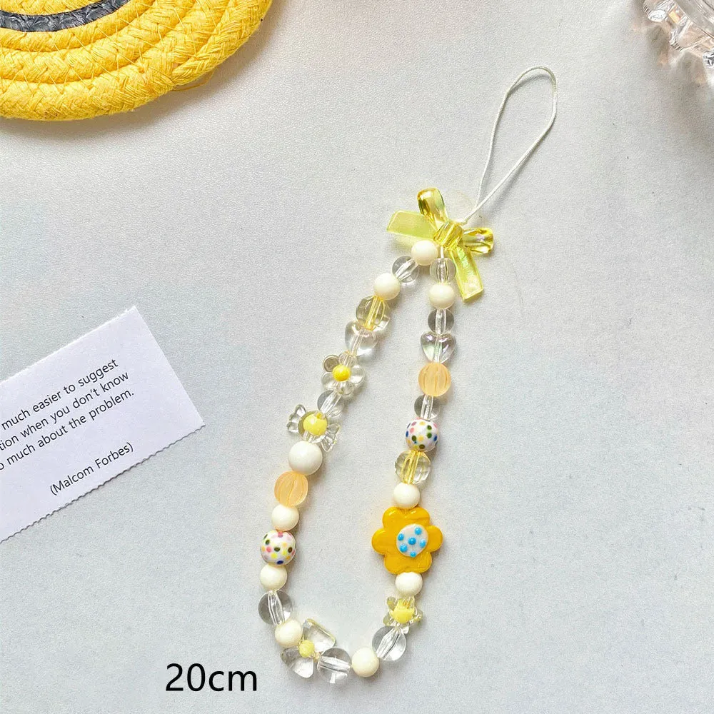 Blue floral beaded mobile phone lanyard with an adjustable hand rope.