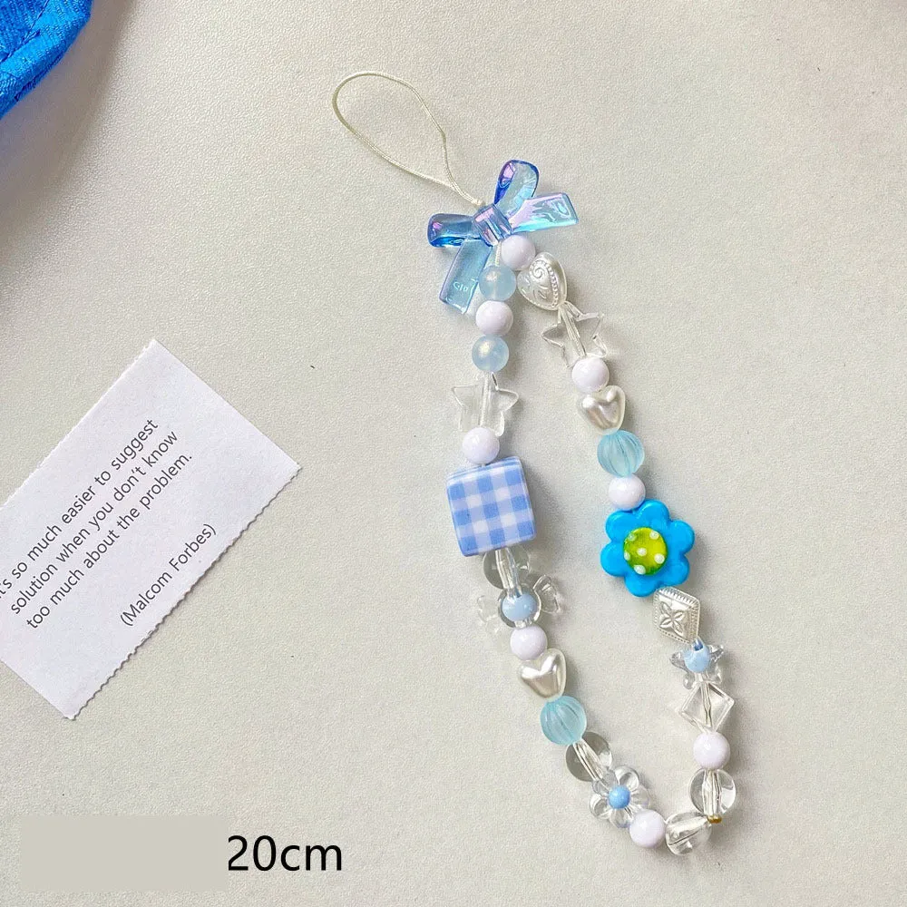 Blue floral beaded mobile phone lanyard with an adjustable hand rope.