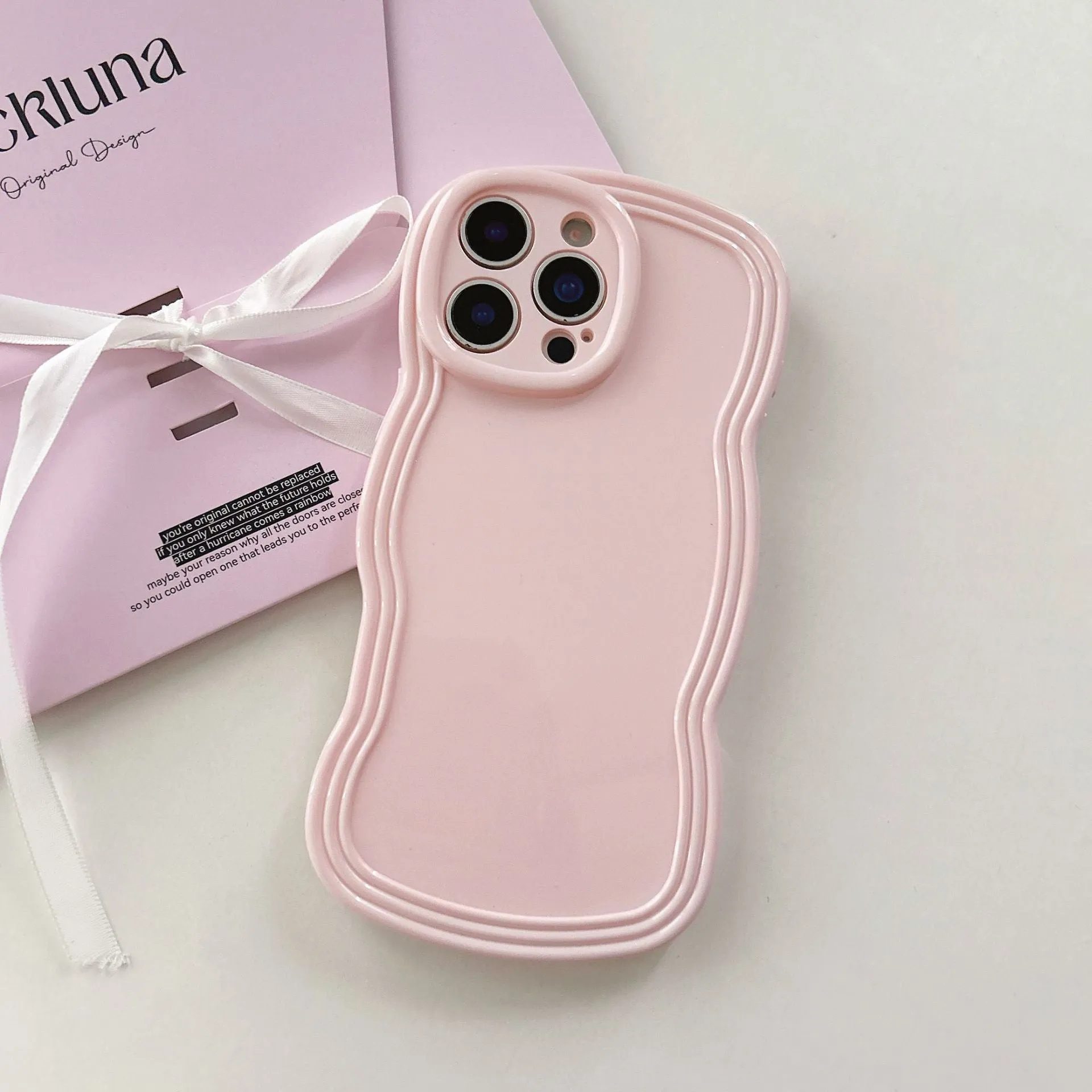 Cream candy colour wave pattern TPU phone case for iPhone, showing anti-fingerprint surface.