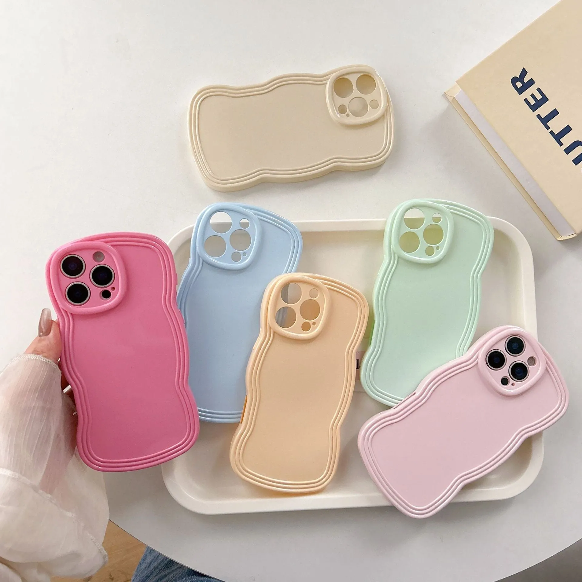 Cream candy colour wave pattern TPU phone case for iPhone, showing anti-fingerprint surface.