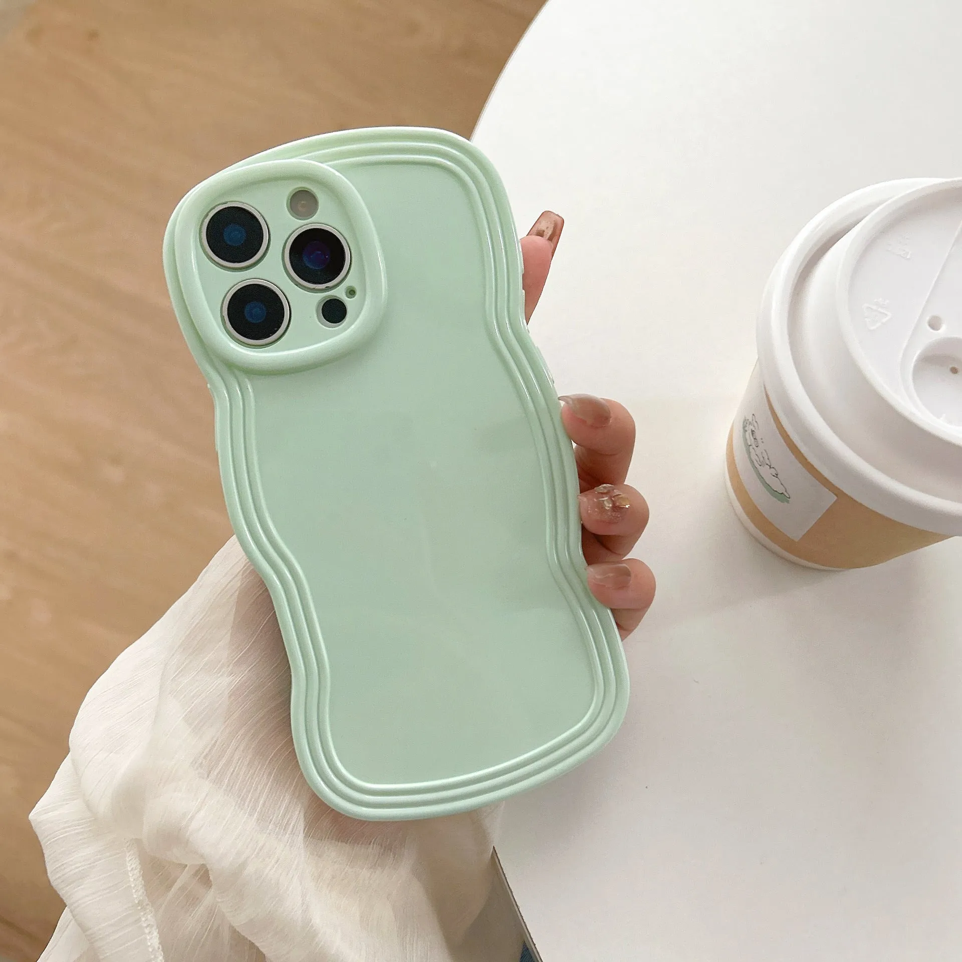 Cream candy colour wave pattern TPU phone case for iPhone, showing anti-fingerprint surface.