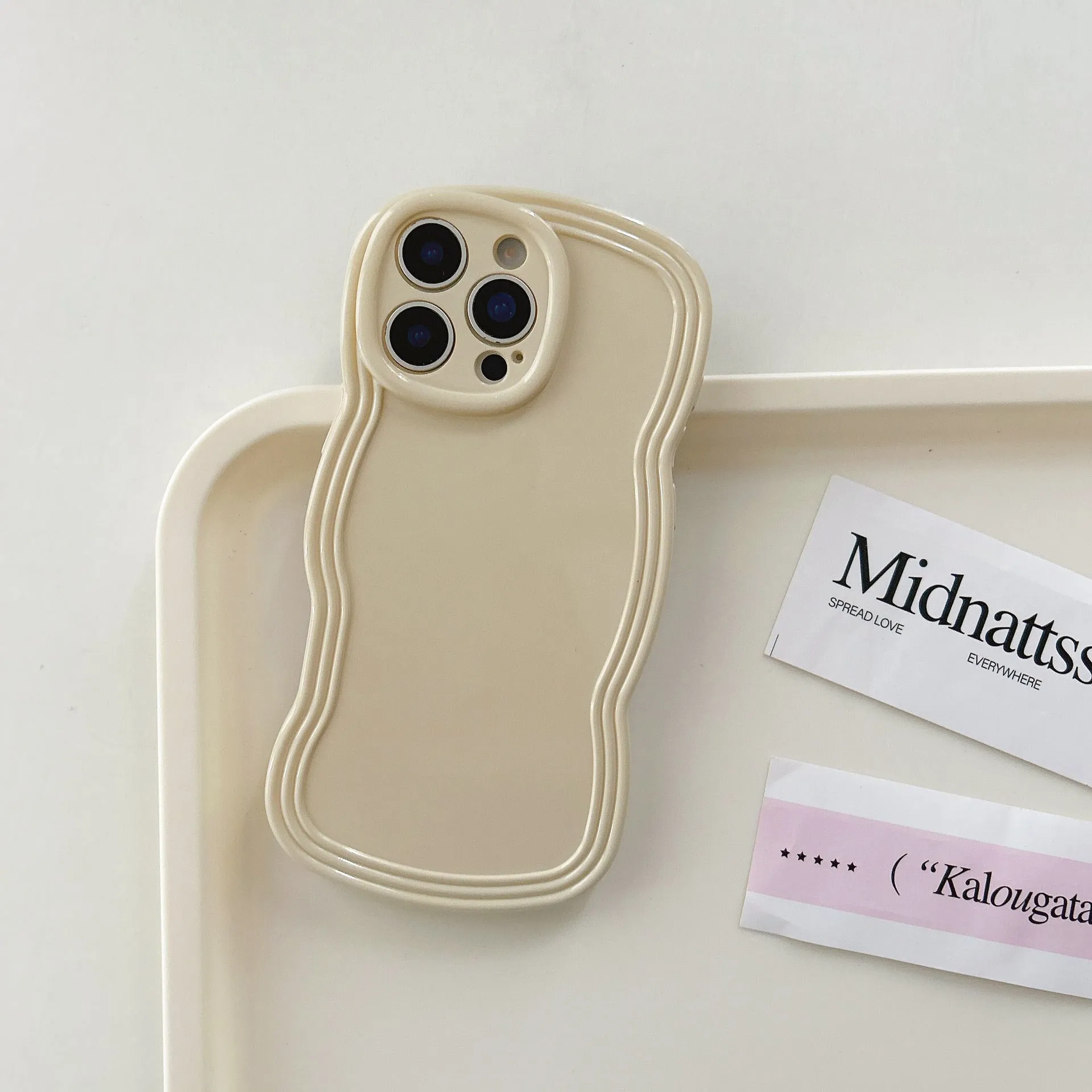 Cream candy colour wave pattern TPU phone case for iPhone, showing anti-fingerprint surface.