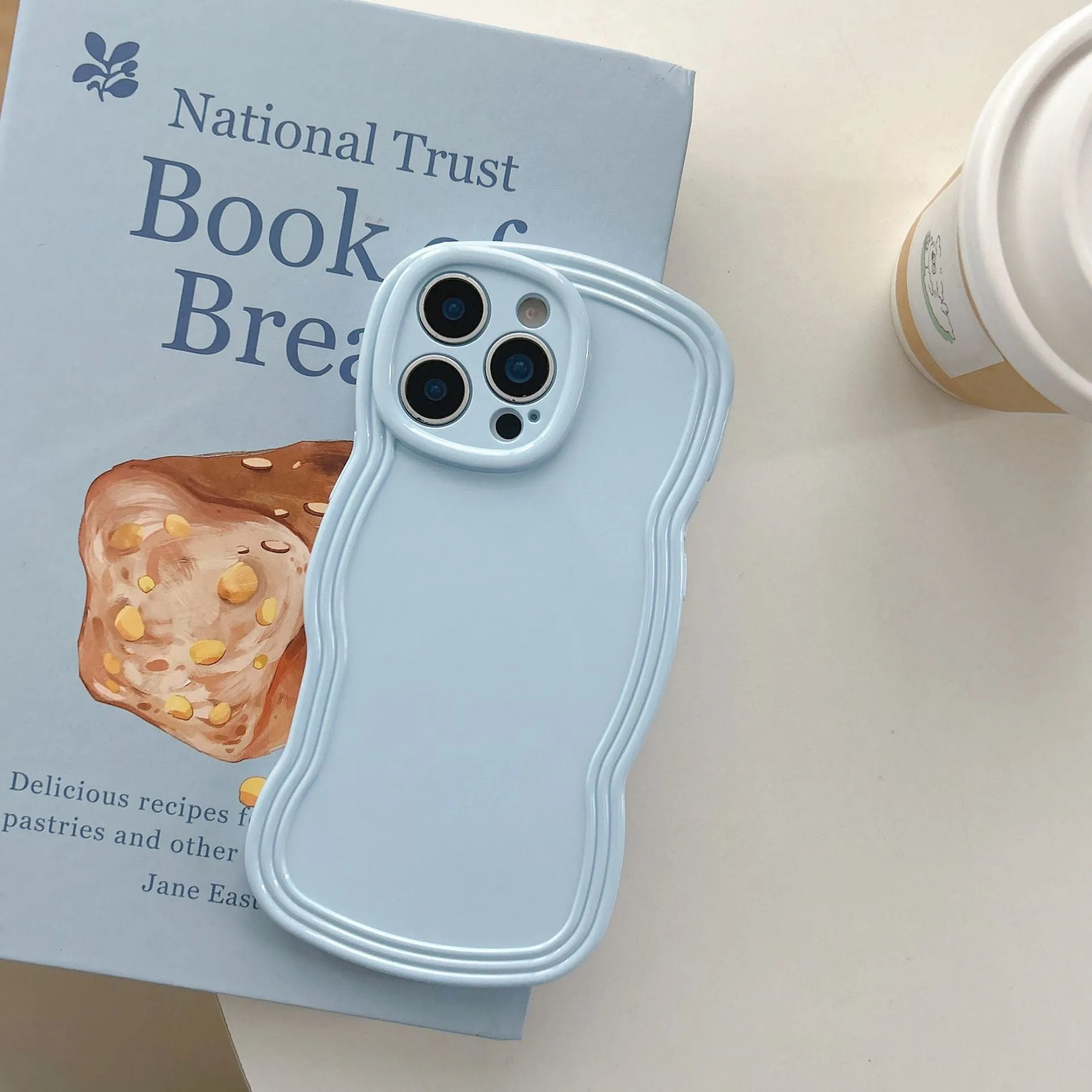Cream candy colour wave pattern TPU phone case for iPhone, showing anti-fingerprint surface.