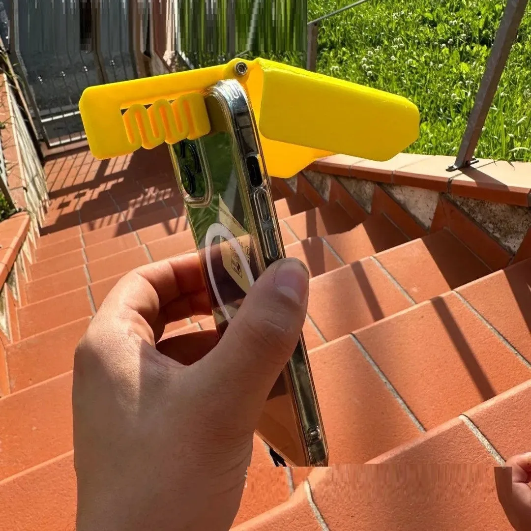 Yellow Creative Beachpool Phone Sunshade Holder clipping onto a smartphone.