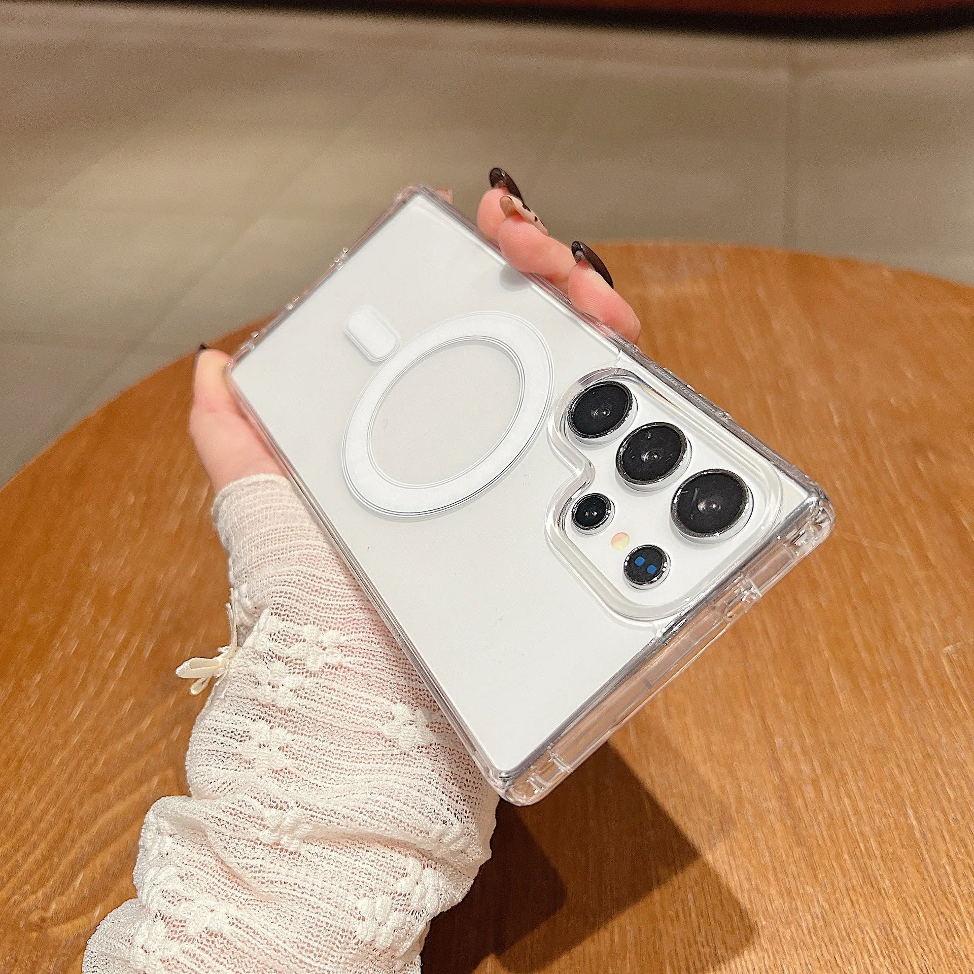 Transparent magnetic silicone phone case for Samsung Galaxy smartphones on a flat surface.