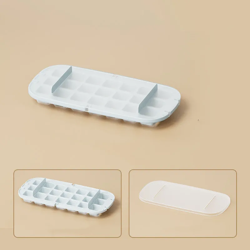 Blue high-capacity ice cube tray with grid design and a built-in storage slot for an ice shovel.