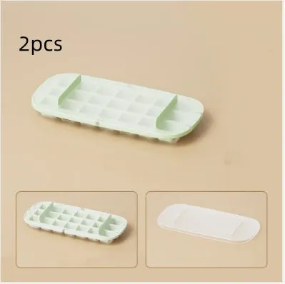 Blue high-capacity ice cube tray with grid design and a built-in storage slot for an ice shovel.