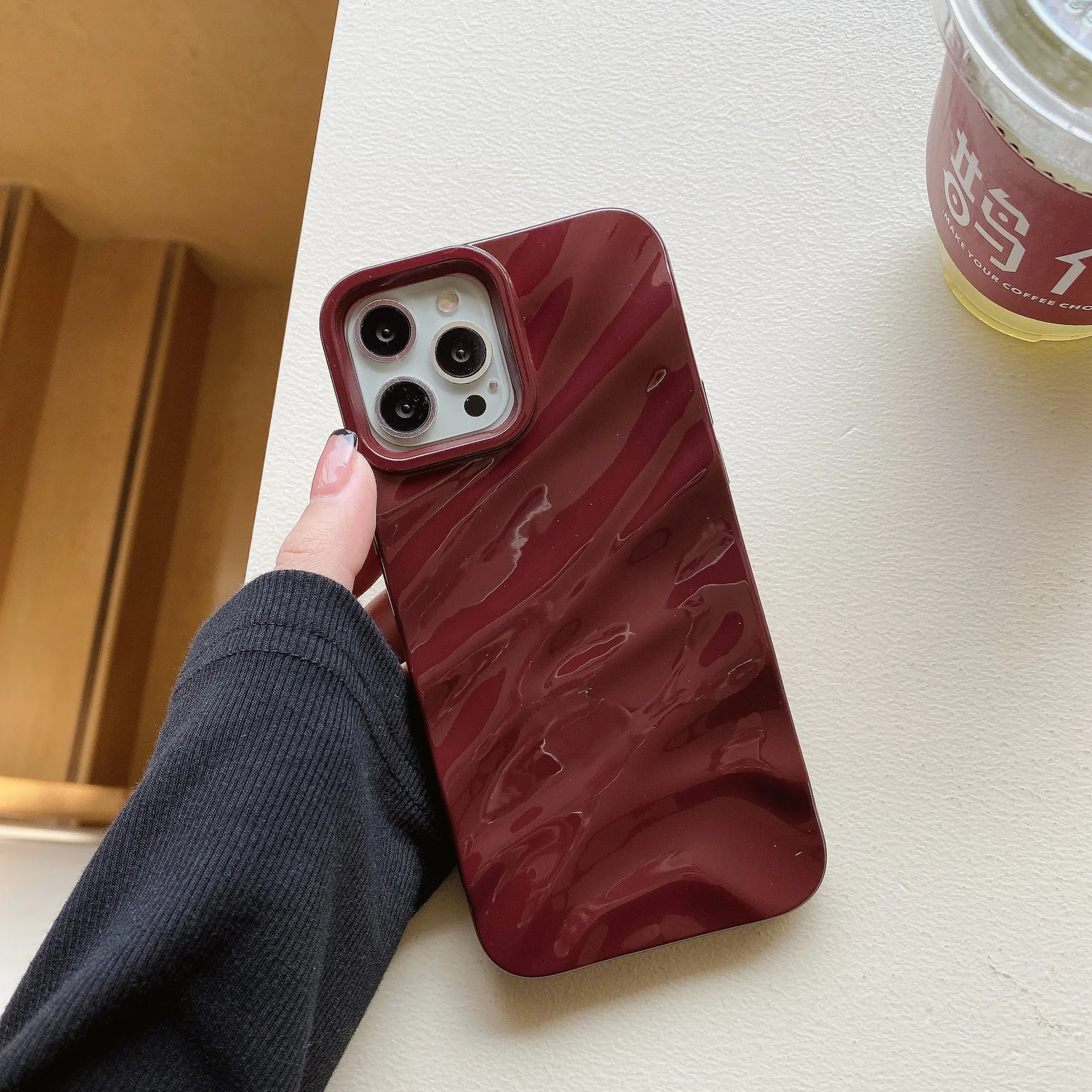 Wave pleated TPU phone case for Apple iPhone 17 in burgundy colour showing textured pattern