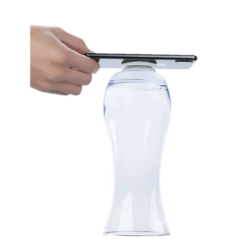 Transparent reusable nano gel adhesive pads in circular and square shapes on a smooth surface