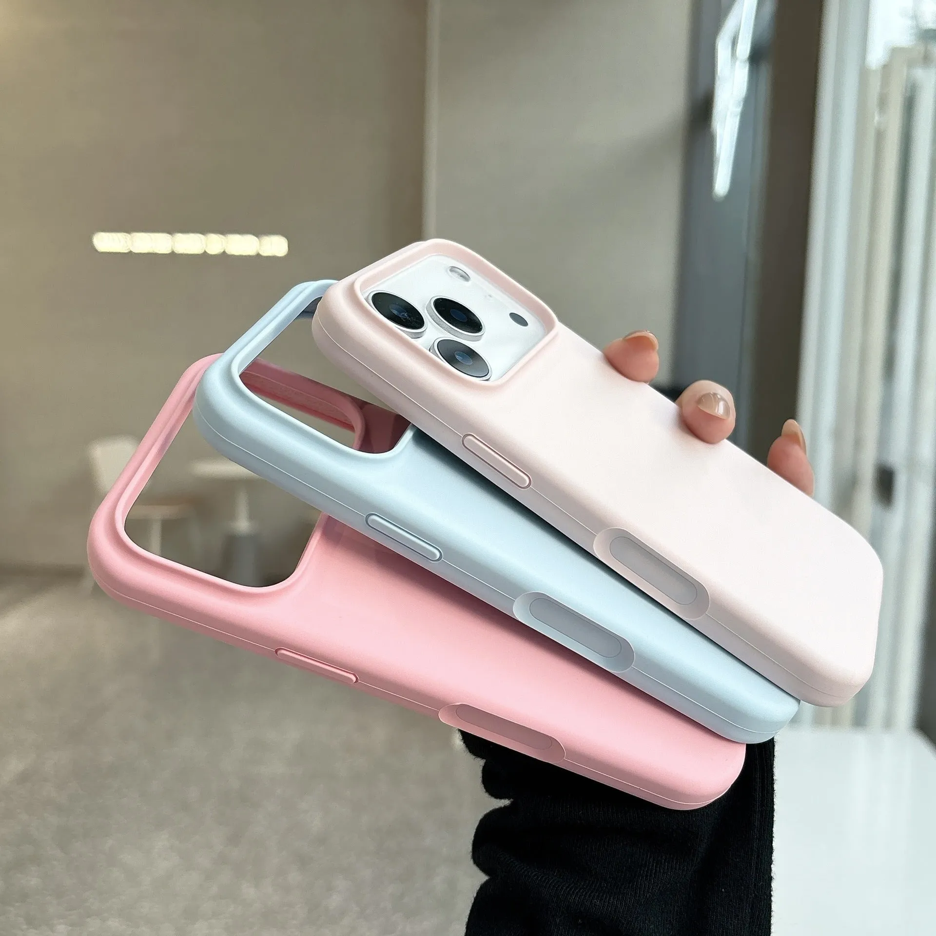 Magnetic liquid silicone phone case for iPhone showing multiple colour options including antique white and desert colour.