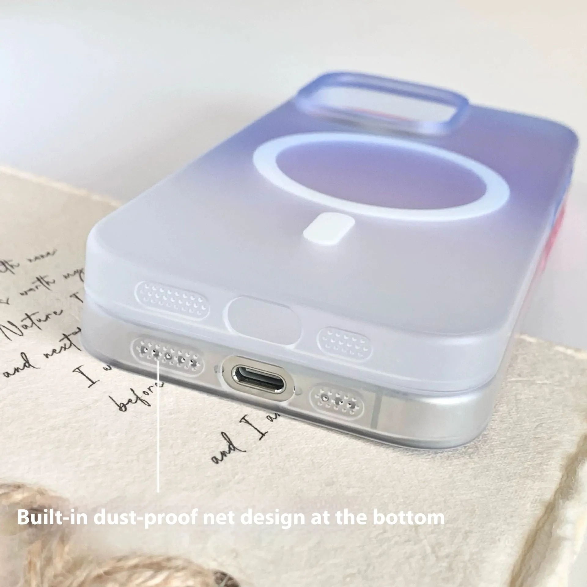 Gradient frosted blue magnetic suction protective case for iPhone on a table.